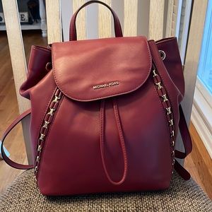 Maroon with gold Michael Kors backpack purse